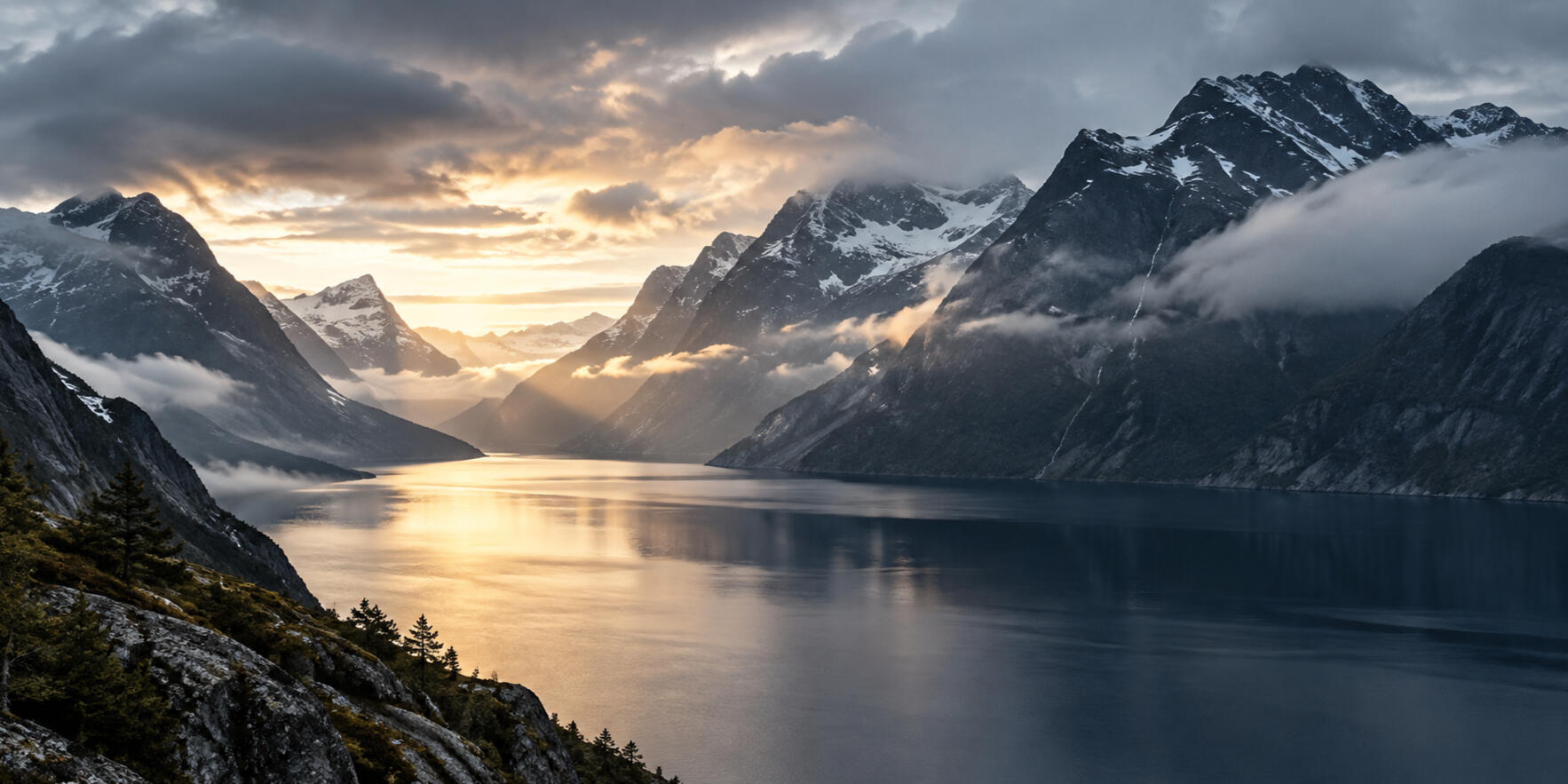 Dramatic Nordic fjord landscape with mountains and evening light